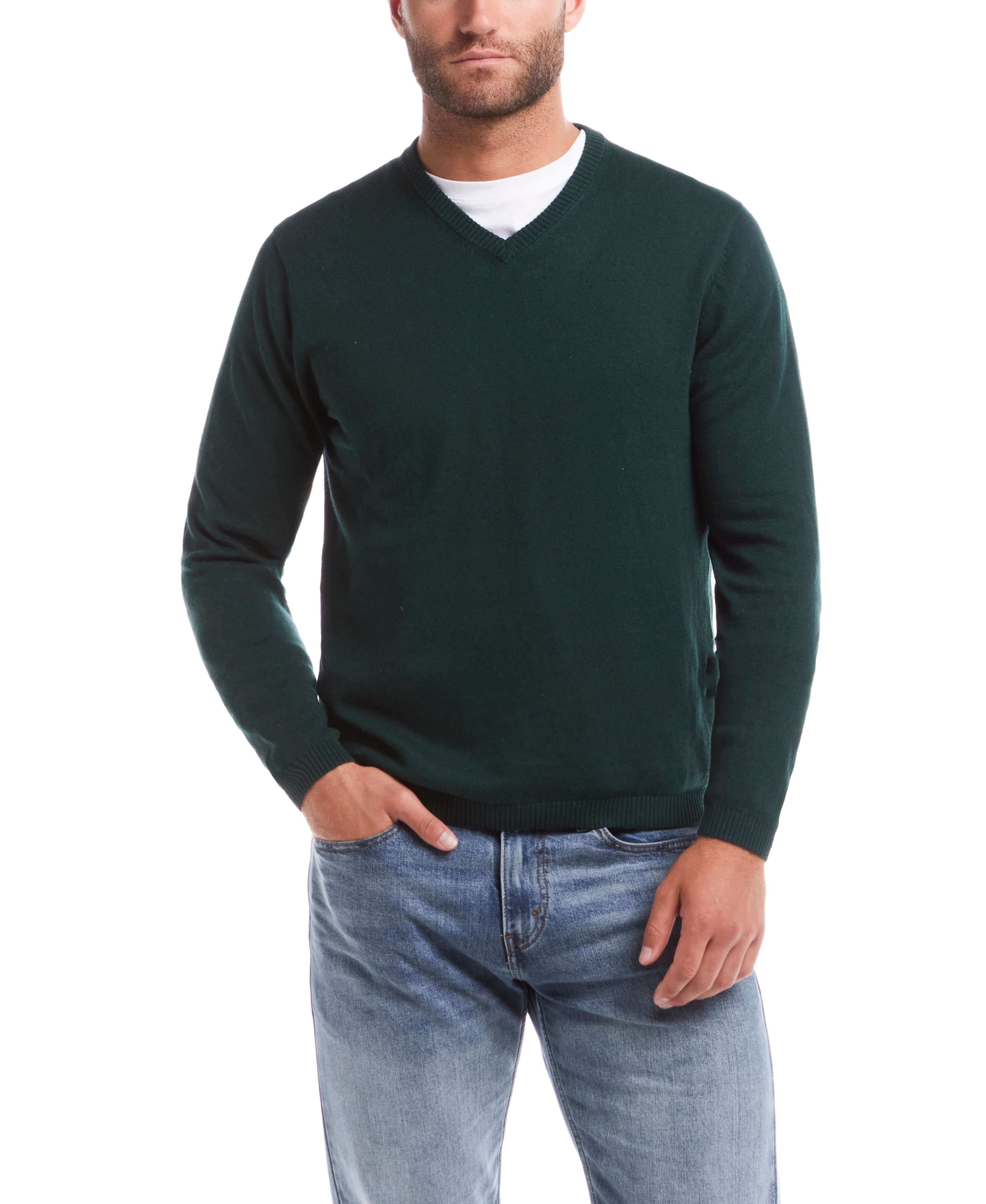 Cotton cashmere holiday v-neck sweater in pine, featuring a casual style and soft blend, modeled by a man in jeans.