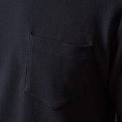 Close-up of the Crinkle Scuba Crew Neck in Black showing pocket detail and soft textured fabric.