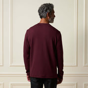 Back view of a man wearing the Crinkle Scuba Crew Neck in Burgundy, showcasing its relaxed fit and soft texture.
