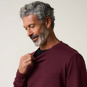 Man in burgundy Crinkle Scuba Crew Neck, showcasing the soft textured scuba knit fabric and relaxed fit.