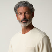 Model wearing Crinkle Scuba Crew Neck in Ivory, showcasing its soft, textured scuba knit fabric and relaxed fit.