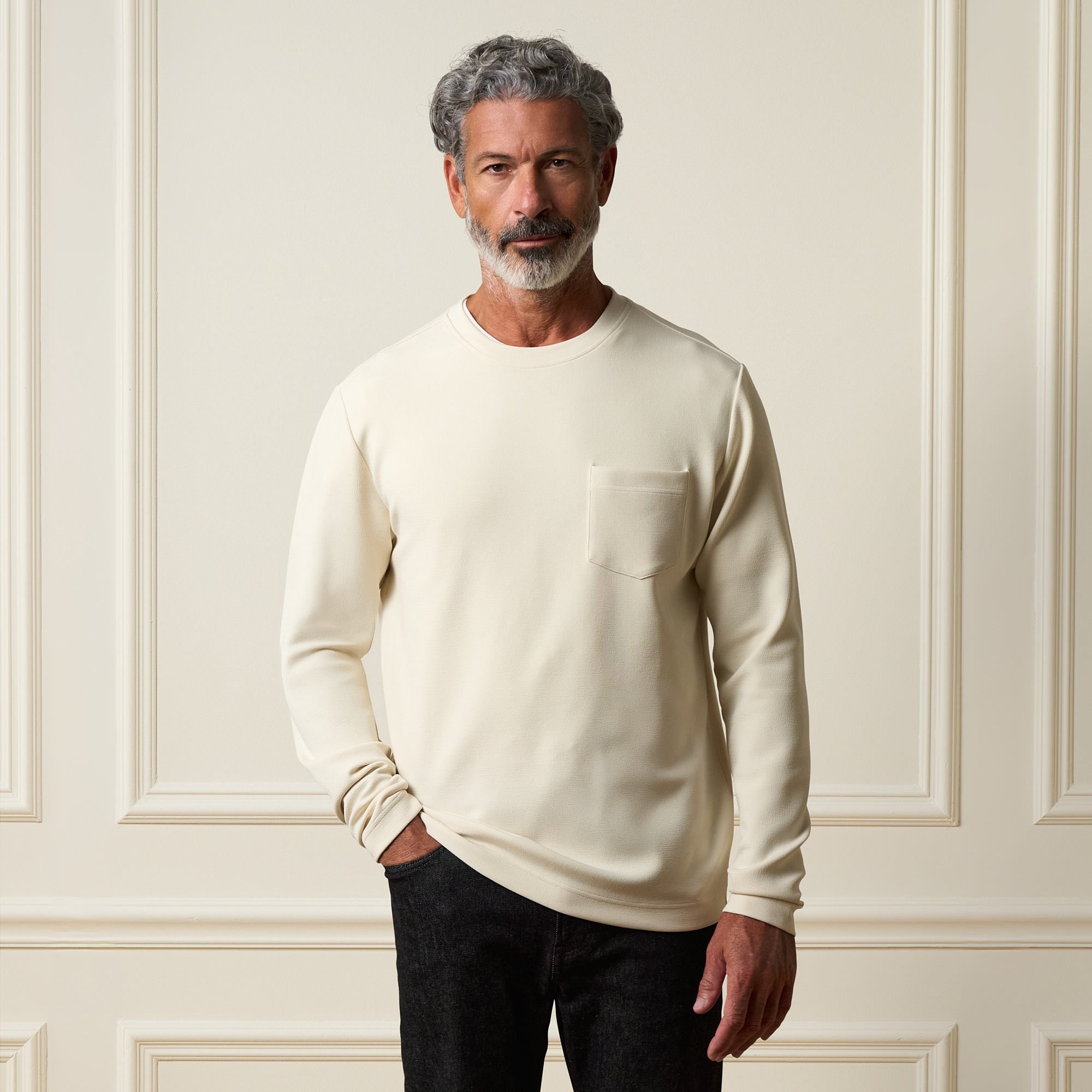 Model wearing Crinkle Scuba Crew Neck in Ivory, showcasing its soft, textured fabric and relaxed fit.