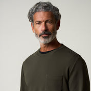 Crinkle Scuba Crew Neck in Olive worn by a model with gray hair and beard, showcasing its textured fabric.