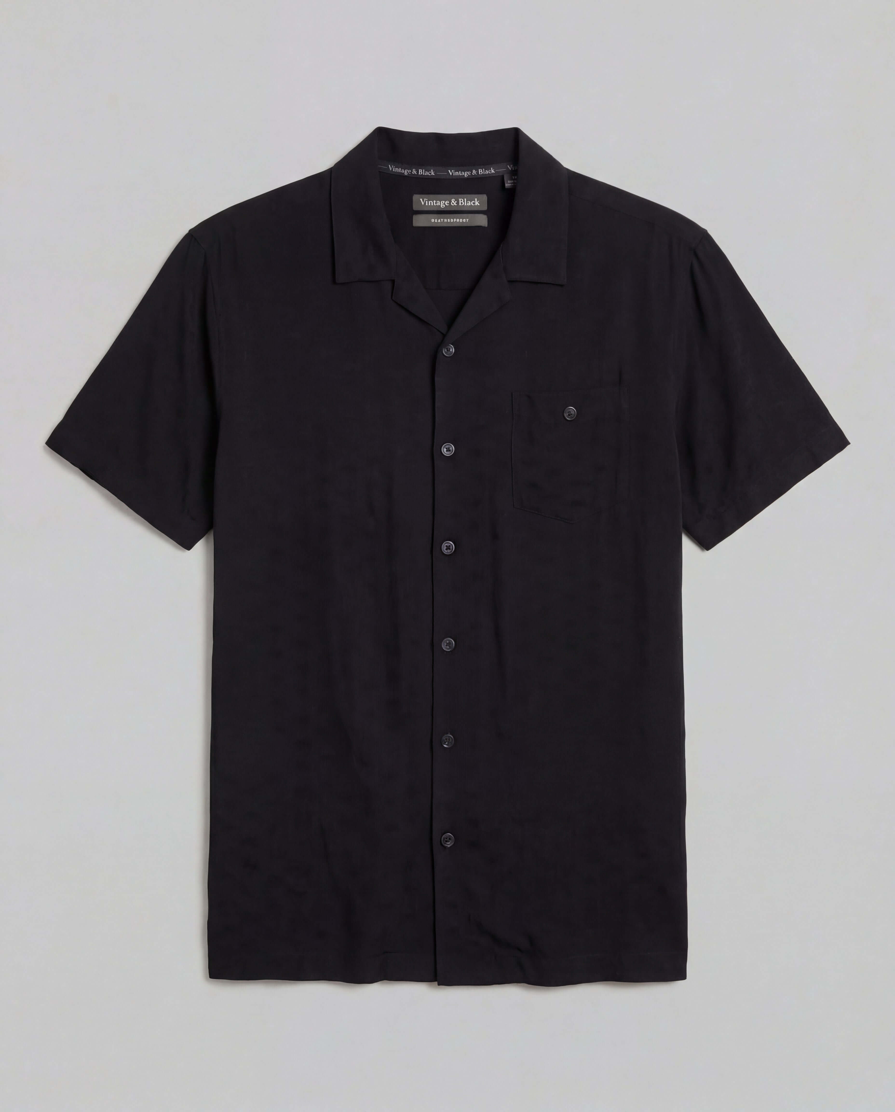 The Dobby Camp Collar Shirt in Black, short sleeve, button-front, chest pocket, lightweight rayon.