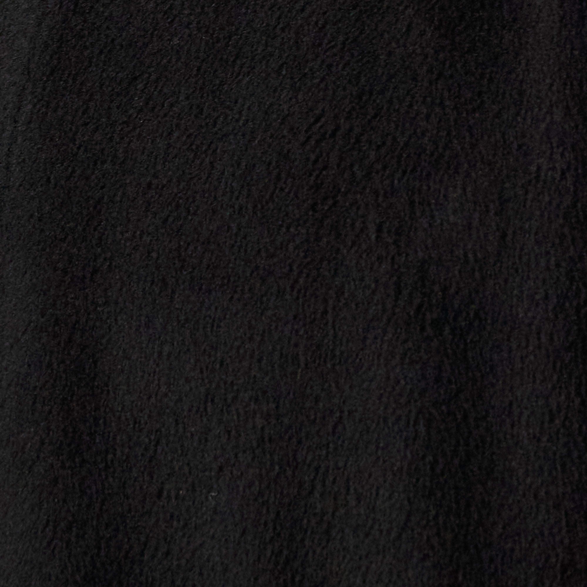 Close-up of soft faux wool fabric in black, highlighting texture and warmth for the Faux Wool Shirt Jacket in Black.