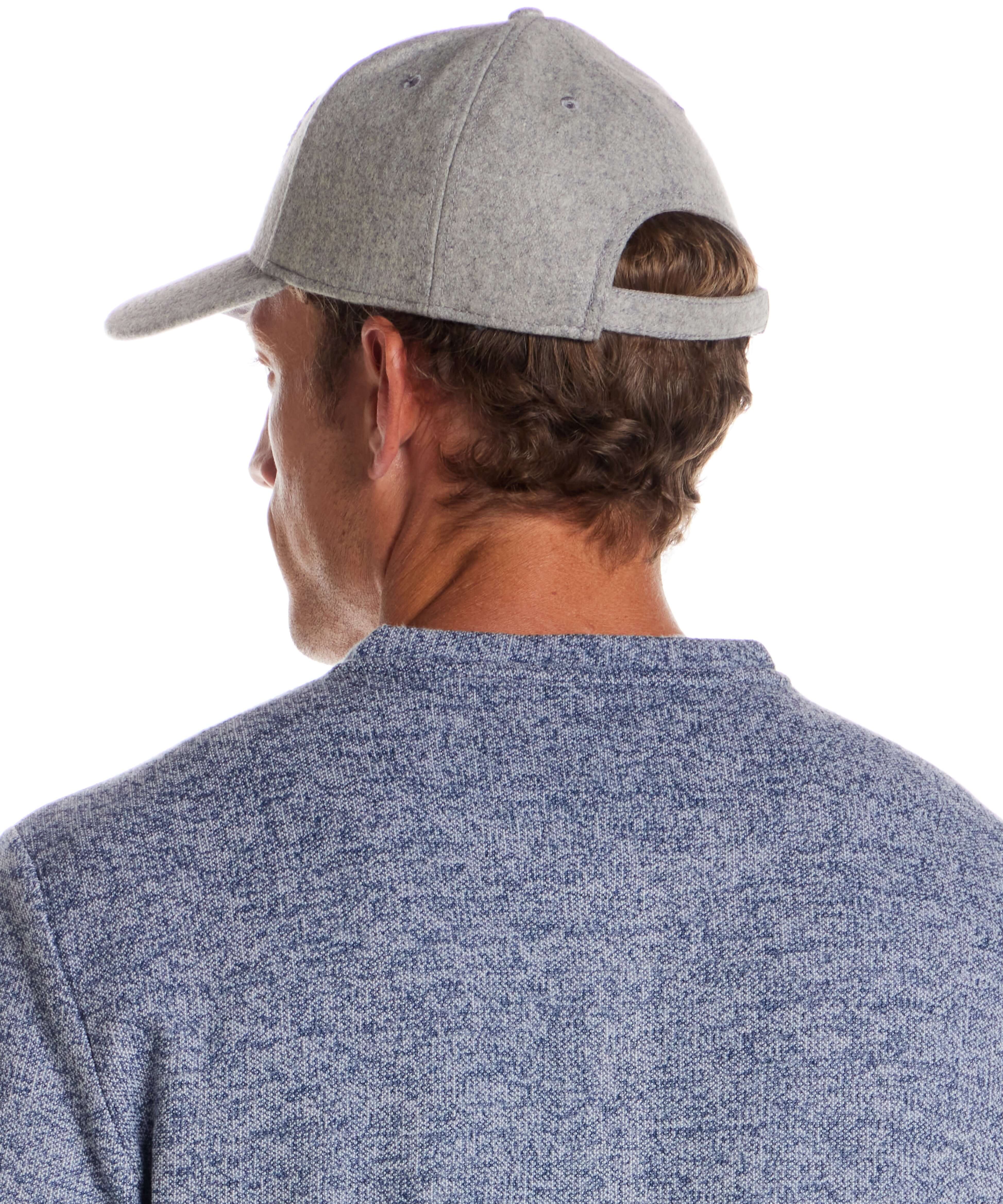 Flannel cap with Appliqué in Light Grey worn by a man from behind, showcasing its premium wool design.