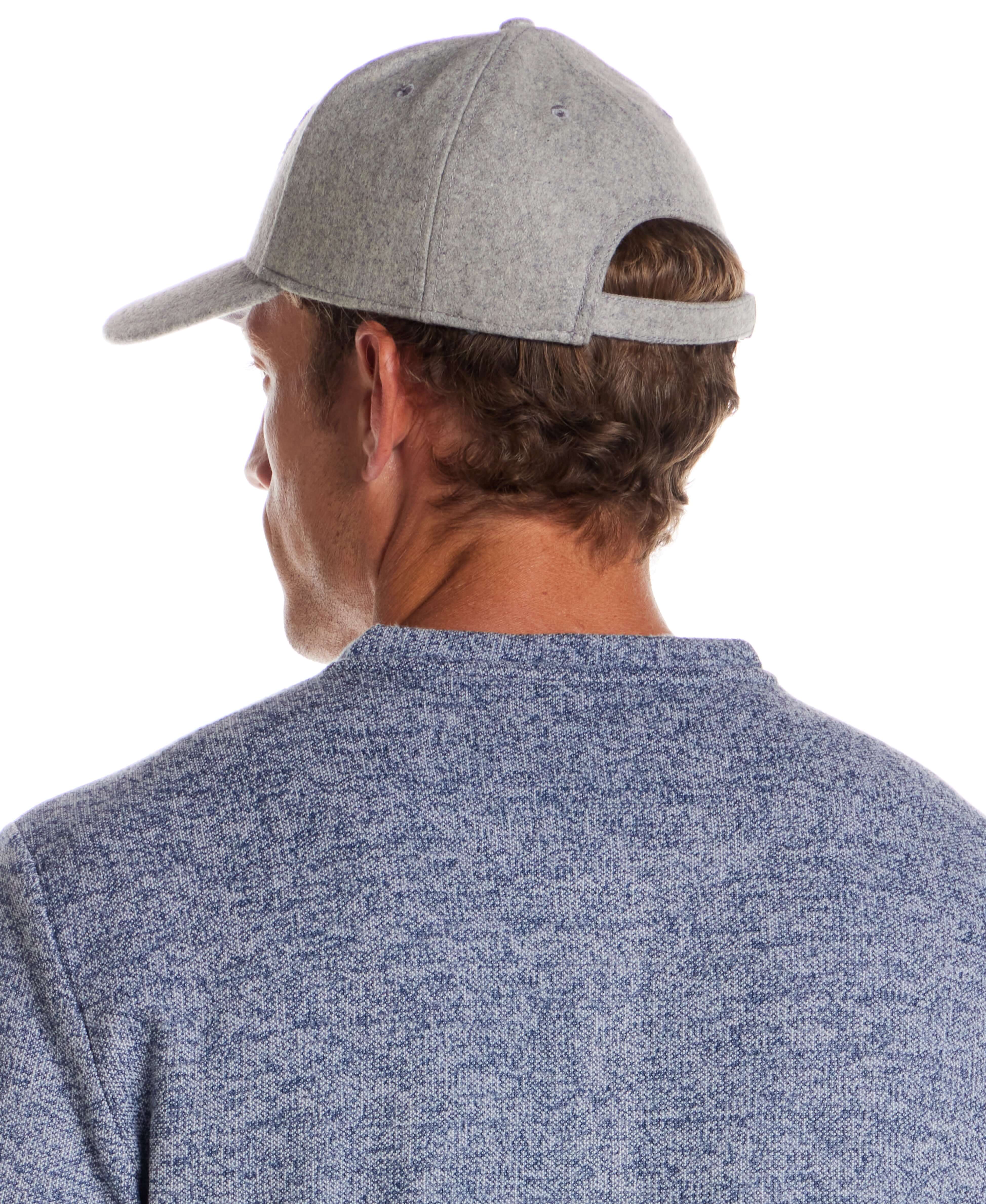 Flannel cap with Appliqué in Light Grey worn by a man from behind, showcasing its premium wool design.