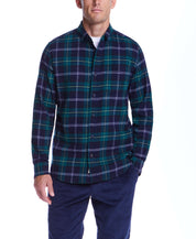 Model wearing Holiday Antique Flannel shirt in verdant green plaid, perfect for a cozy holiday wardrobe.