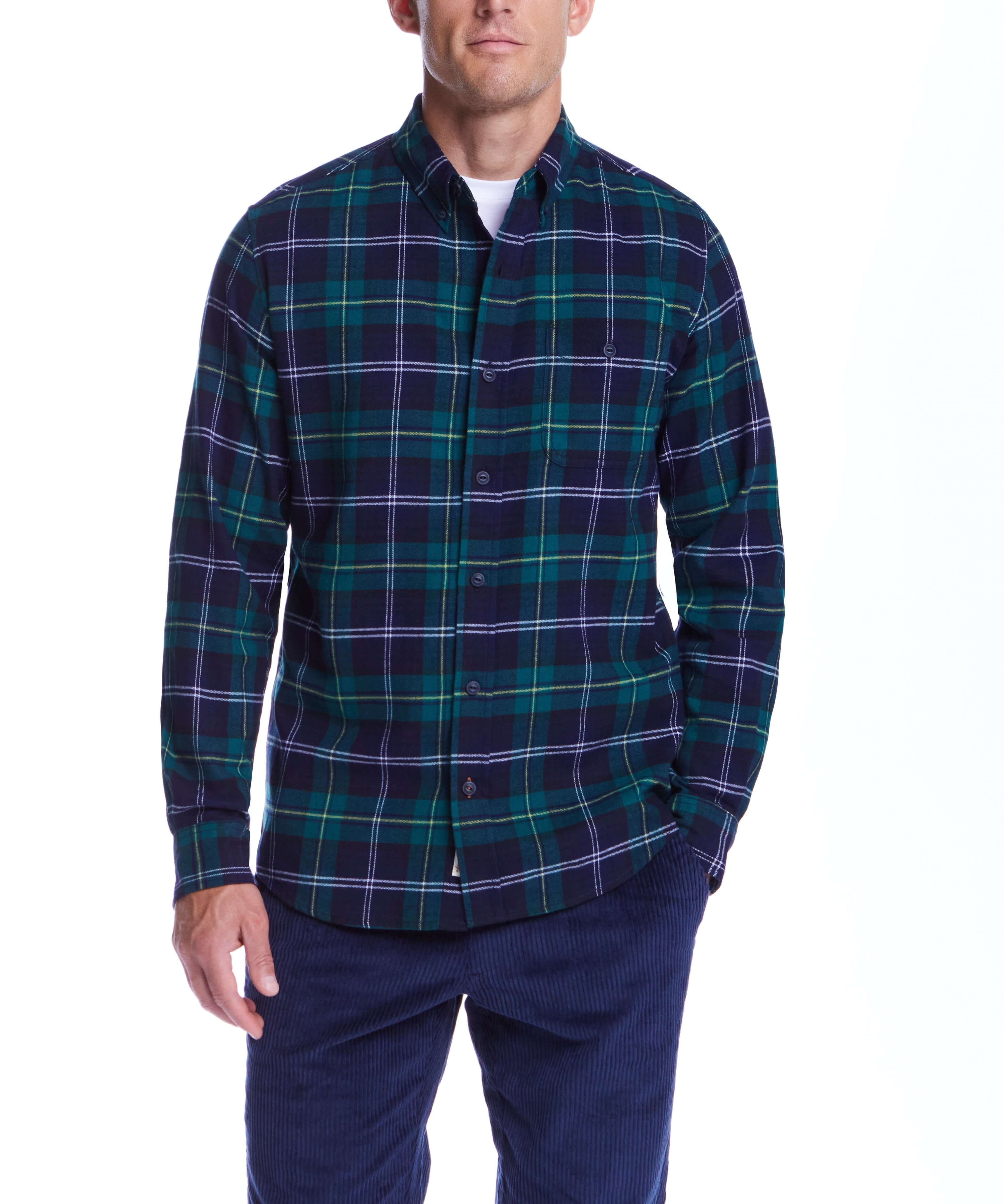 Model wearing Holiday Antique Flannel shirt in verdant green plaid, perfect for a cozy holiday wardrobe.