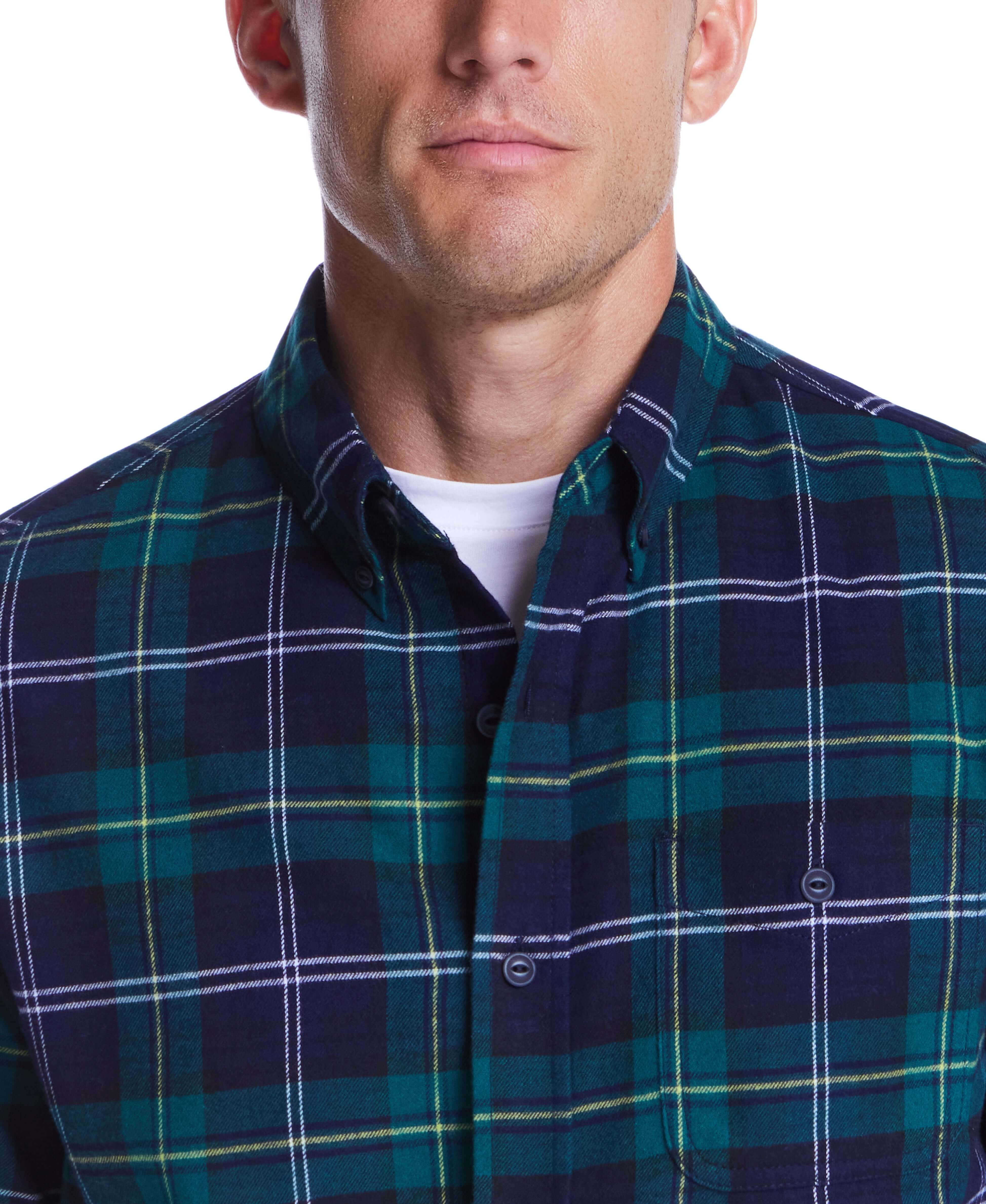 Close-up of a man wearing the Holiday Antique Flannel in verdant green, featuring a button-down collar and chest pocket.
