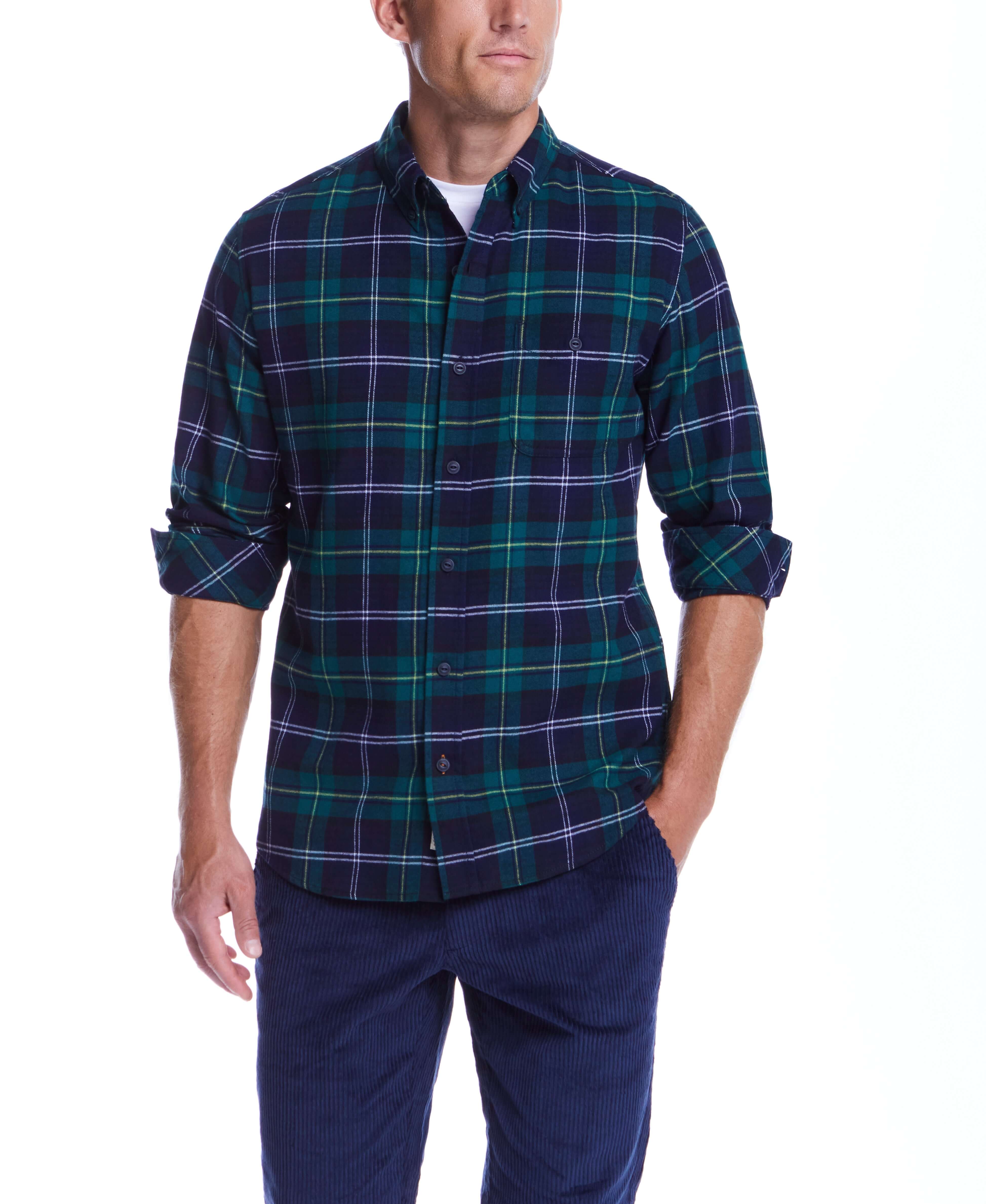 Model wearing Holiday Antique Flannel in Verdant Green, featuring a button down collar and a stylish plaid design.