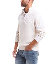 Model wearing the Holiday Cable Yoke Quarter Zip Sweater in Ecru, showcasing its classic fit and Aran cable design.