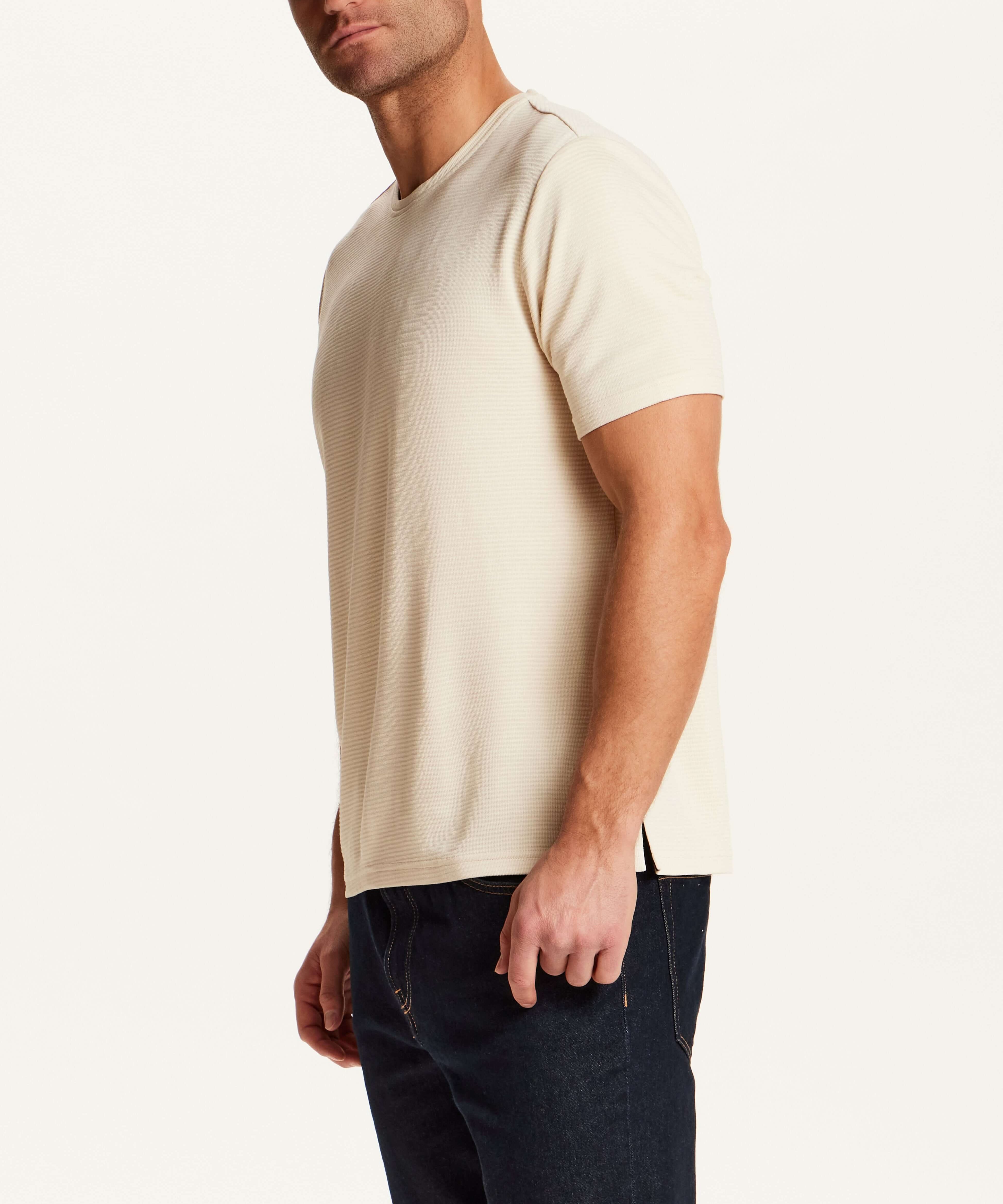 Horizontal Rib Tee in Cream worn by a model, showcasing its soft modal blend and refined drape.