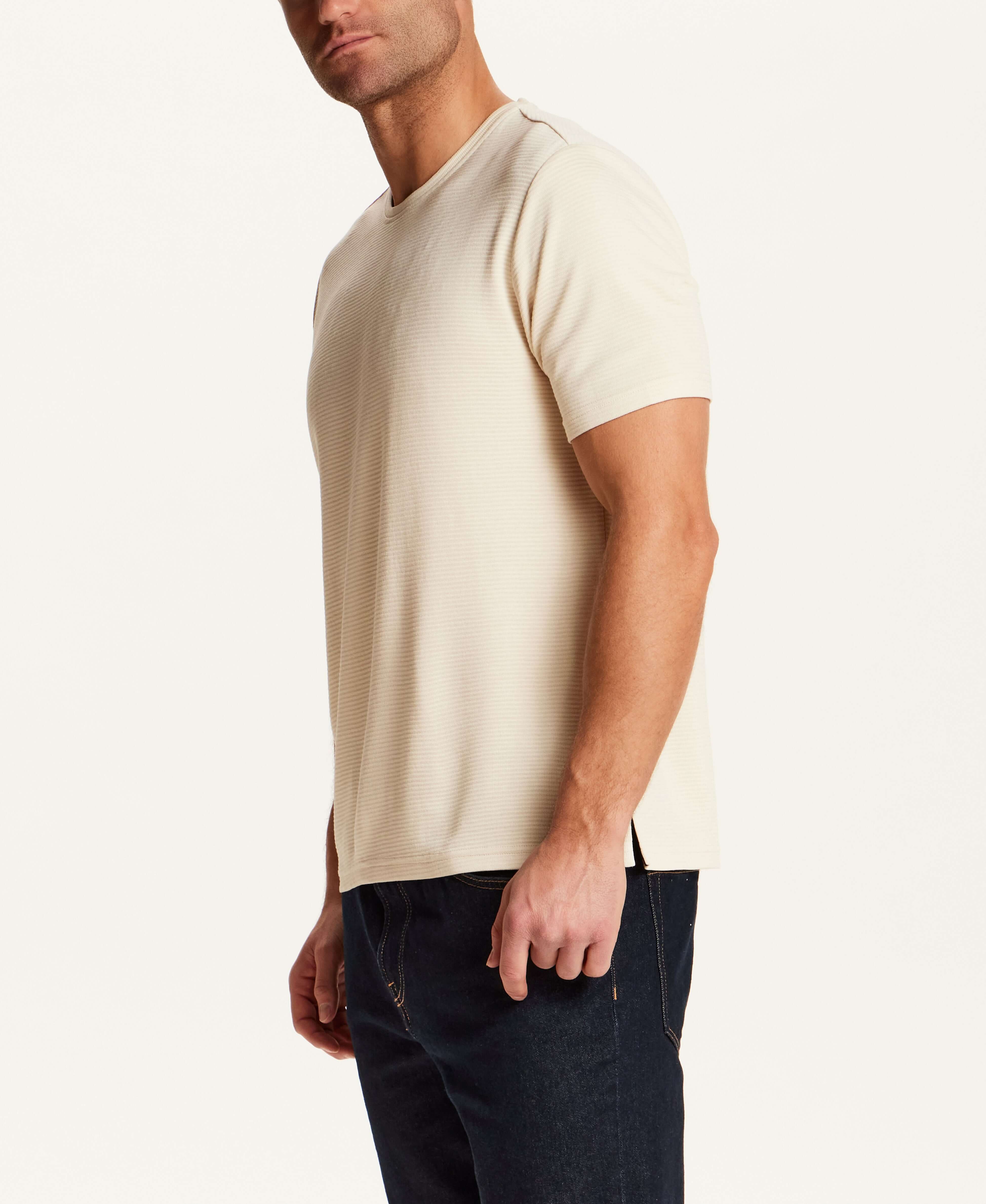Horizontal Rib Tee in Cream worn by a model, showcasing its soft modal blend and refined drape.