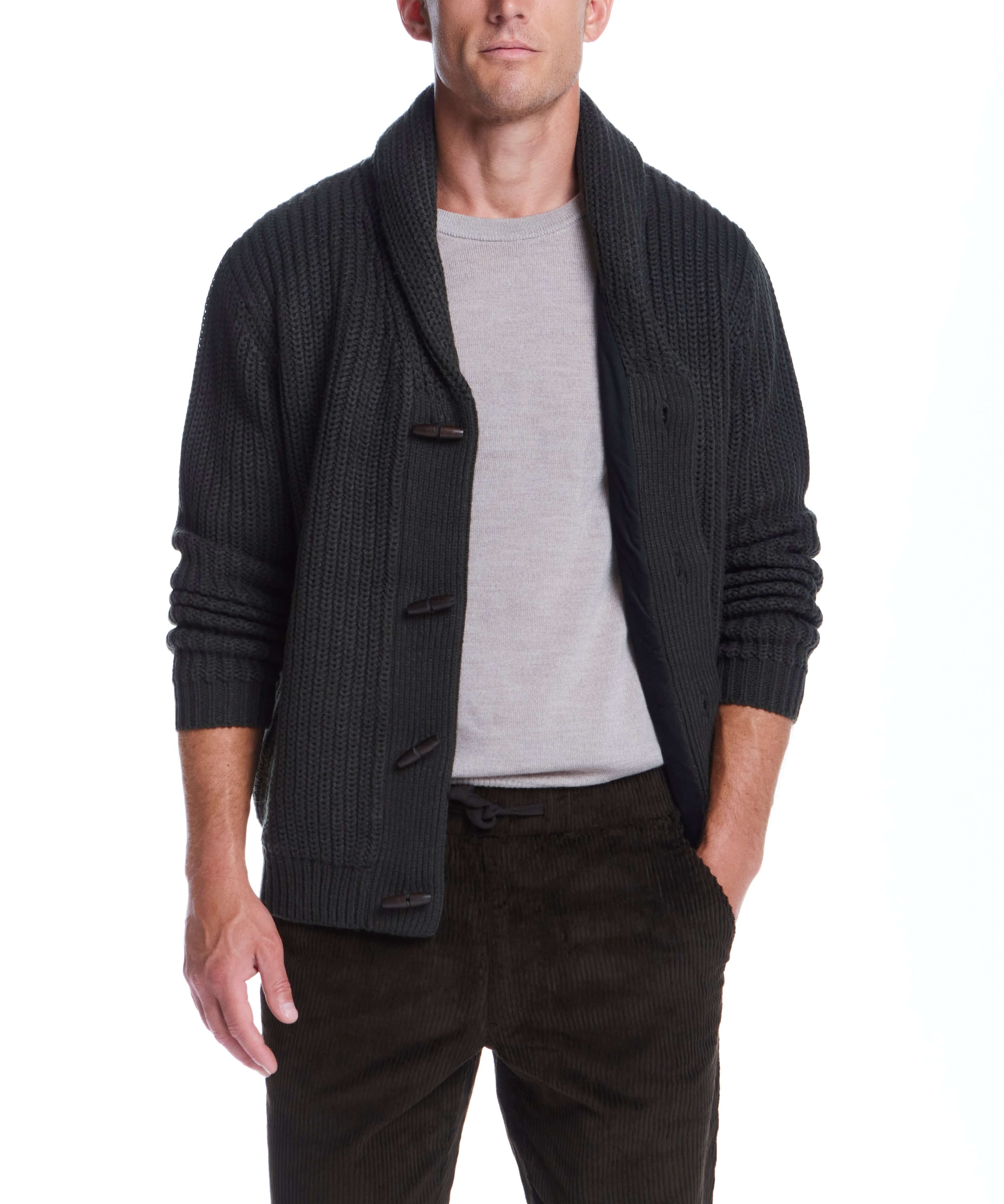Man wearing a dark olive shawl collar cardigan with wood toggle buttons and rib-knit details.