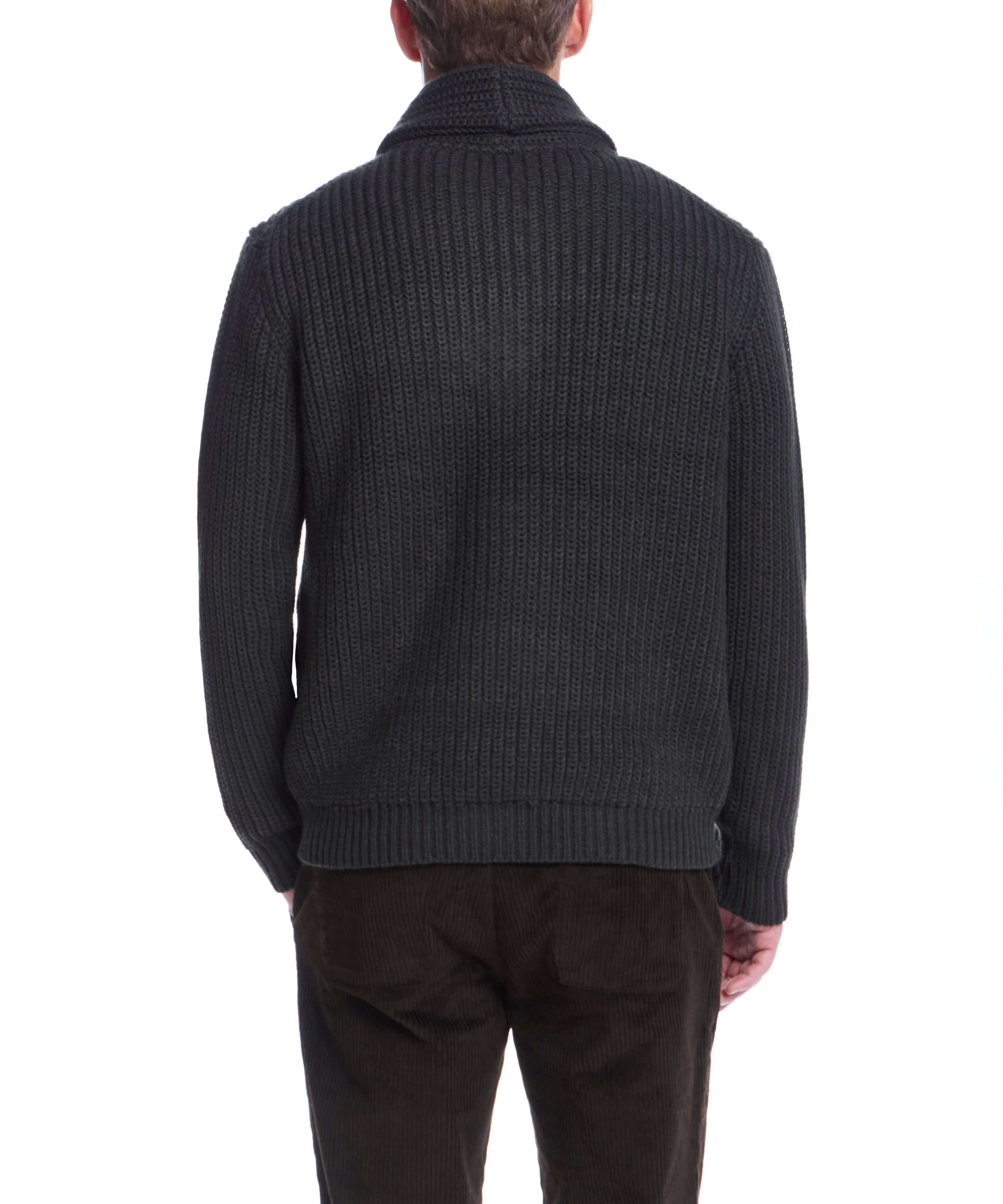 Back view of a man in a dark olive jersey lined shawl collar cardigan with rib-knit cuffs and hem.