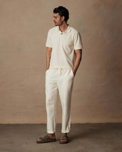 Model wearing Linen Blend Drawstring Pants in White, showcasing relaxed fit and elastic waistband.
