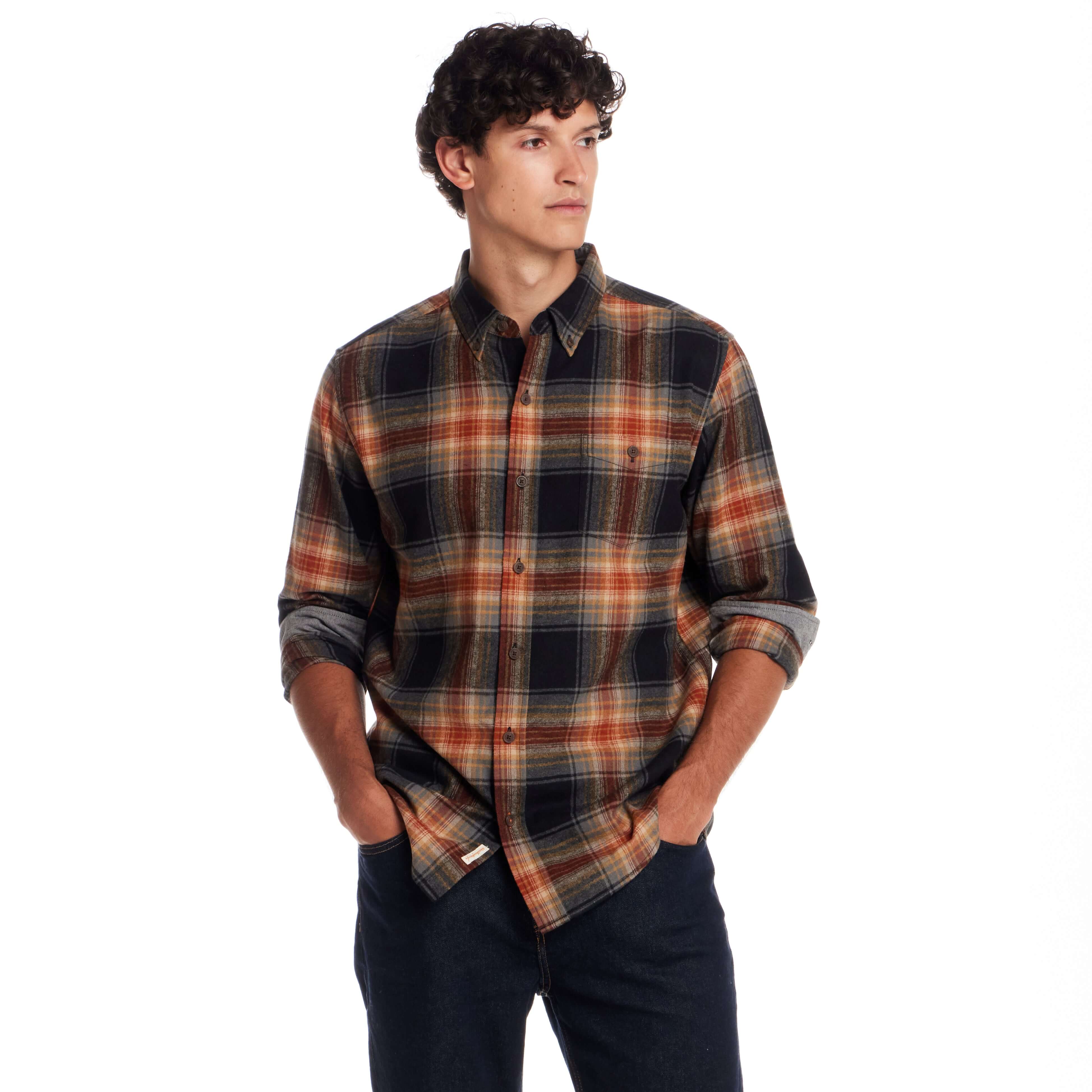 Long Sleeve Brushed Flannel in Bombay Brown model wearing a plaid shirt, showcasing a rugged and vintage style.