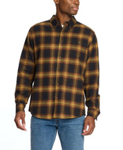 Man wearing a Long Sleeve Brushed Flannel in Inca Gold, featuring a classic plaid pattern and button-down collar.
