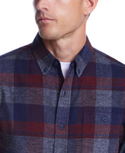 Man wearing a stylish red maroon brushed flannel shirt with a button-down collar and plaid pattern.