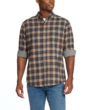 Man wearing a long sleeve brushed flannel shirt in sharkskin color with a plaid pattern, styled for casual comfort.