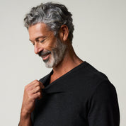 Model wearing Long Sleeve Brushed V-Neck in Charcoal, showcasing the soft fabric and relaxed fit.