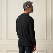 Man in Long Sleeve Brushed V-Neck in Charcoal, showcasing the back view, highlighting the soft texture and regular fit.