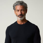 Long Sleeve Crew Neck in Black worn by a man with grey hair and beard, showcasing comfort and style.