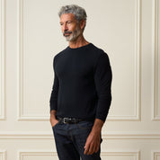 Long Sleeve Crew Neck in Black displayed on a model in a stylish setting, showcasing its regular fit and smooth finish.