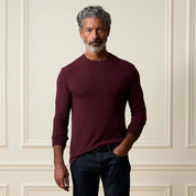 Long Sleeve Crew Neck in Burgundy model wearing a relaxed fit shirt with long sleeves against a neutral background.