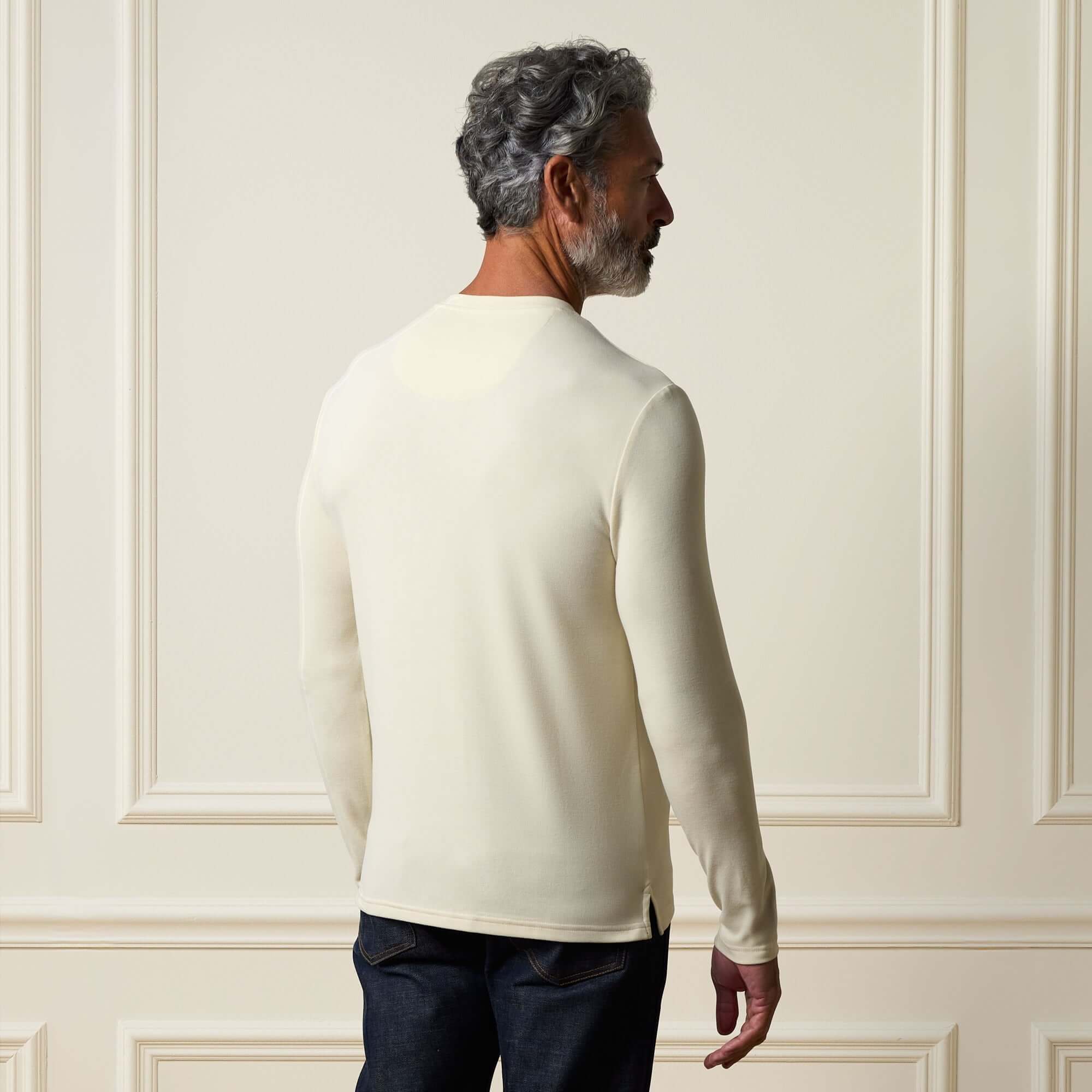 Man wearing Long Sleeve Crew Neck in Ivory, showcasing the back design and smooth finish.
