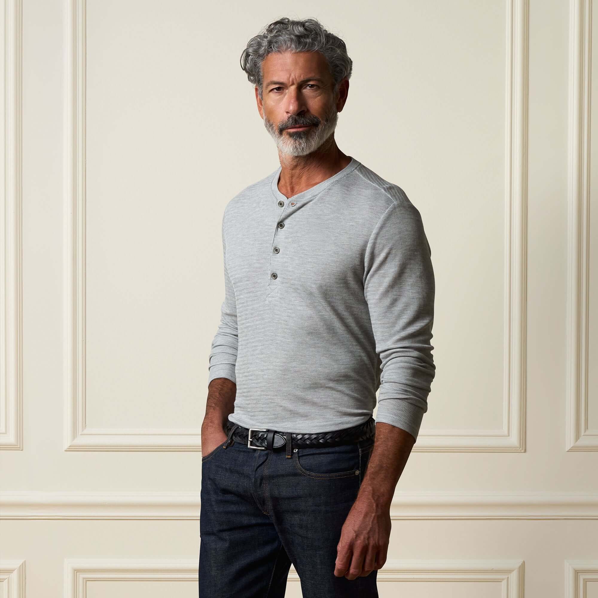 Long Sleeve Crinkle Henley in Grey Heather worn by a man, featuring a button placket and long sleeves.