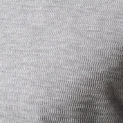 Close-up view of the lightly crinkled texture of the Long Sleeve Crinkle Henley in Grey Heather.