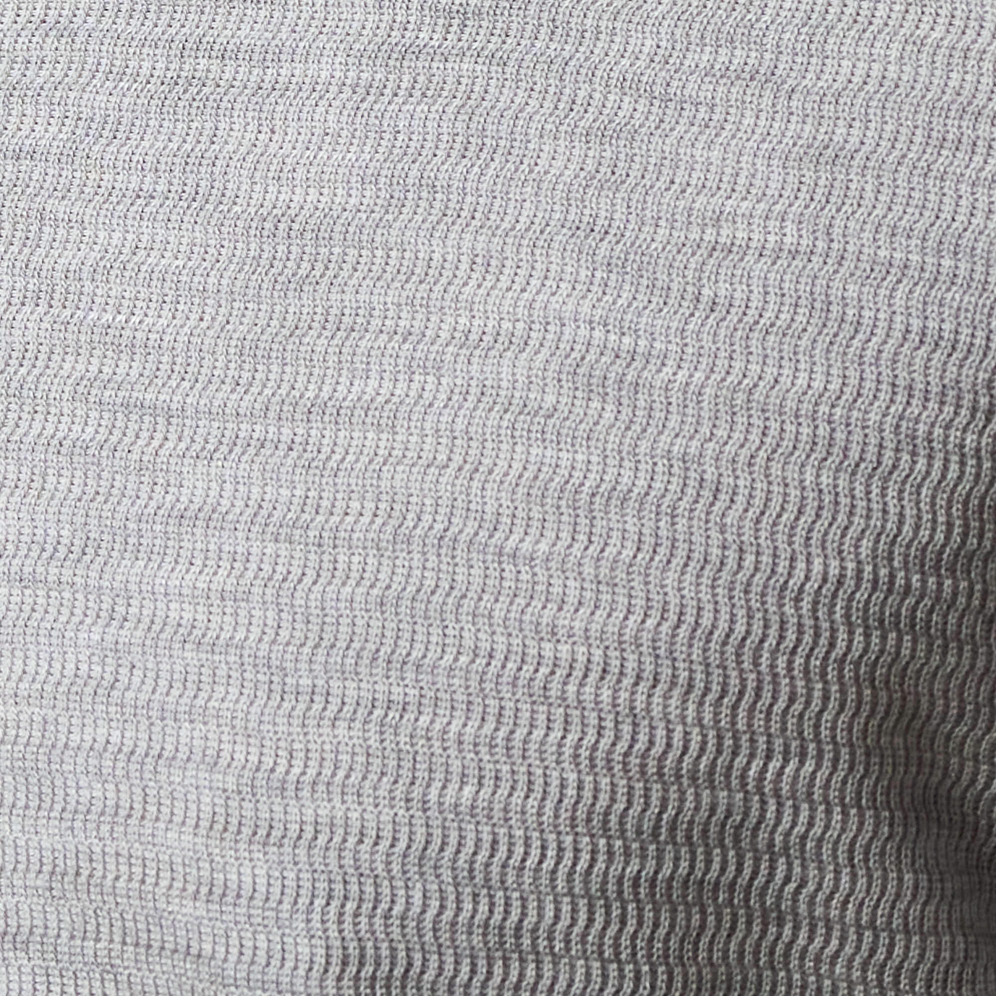 Close-up view of the lightly crinkled texture of the Long Sleeve Crinkle Henley in Grey Heather.