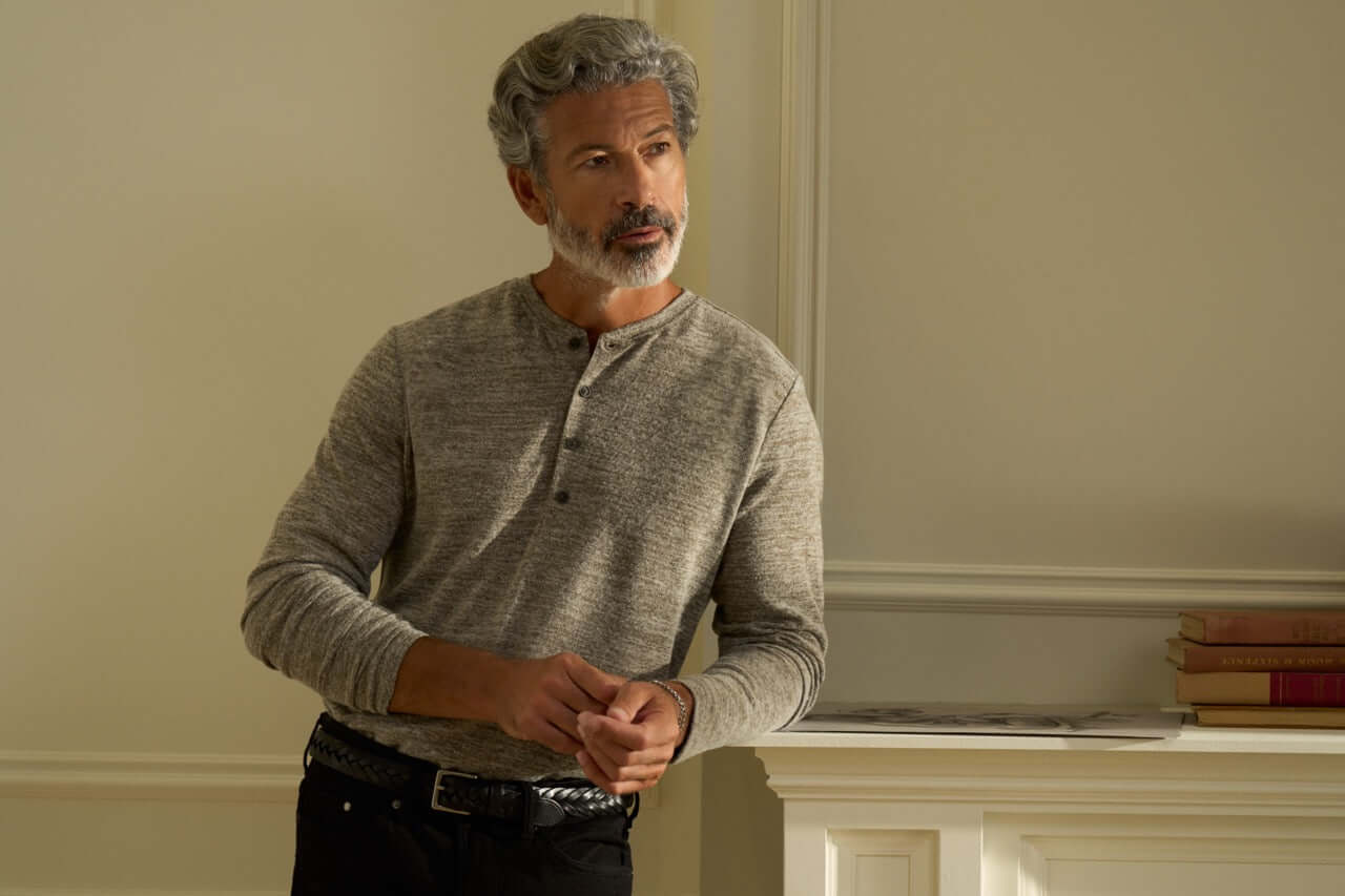 Long Sleeve Mixy Henley in Dark Brown worn by a man with grey hair, showcasing its pullover style and Henley neckline.
