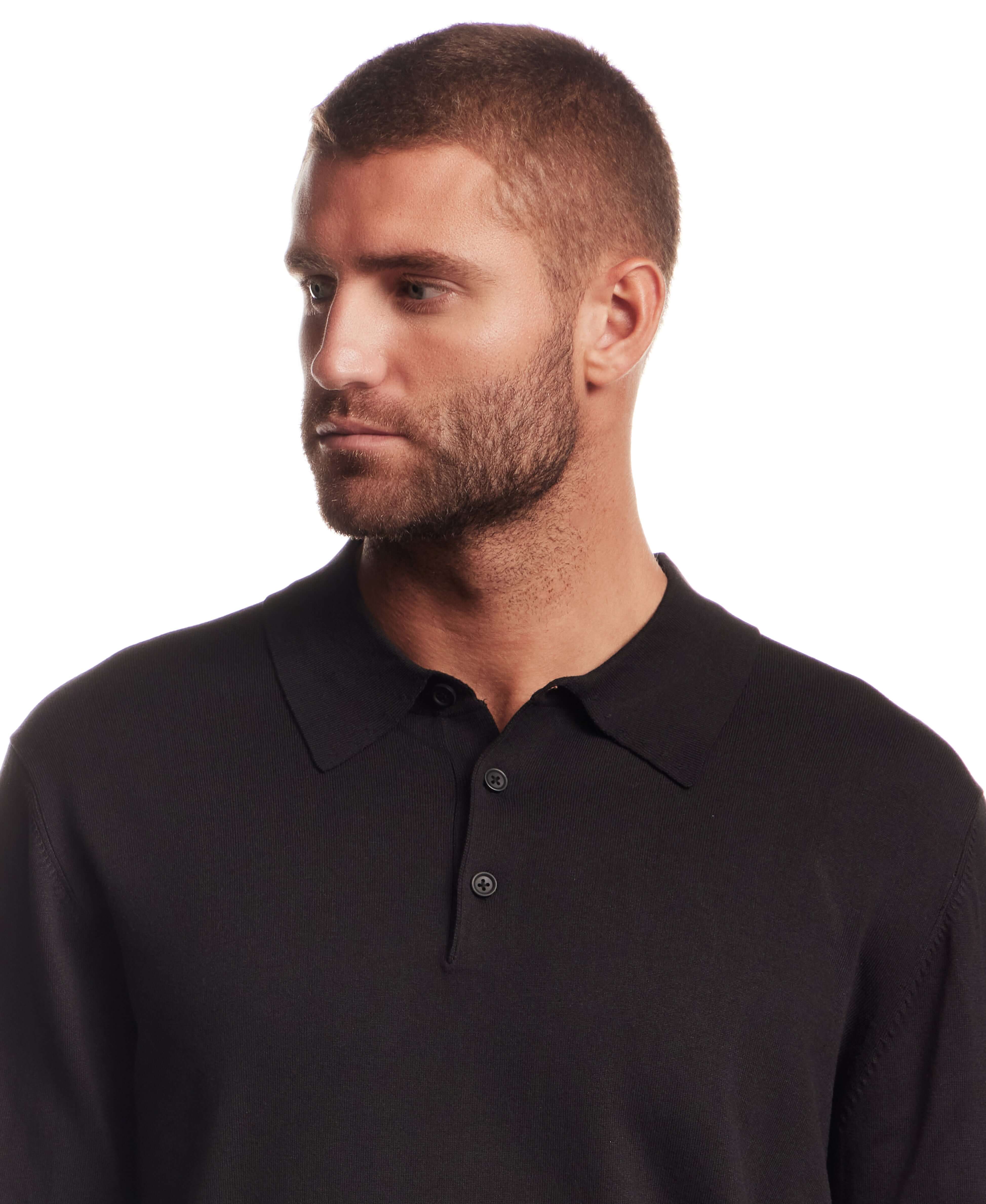 Model wearing a Long Sleeve Polo Sweater in Black featuring a polo collar and long sleeves.