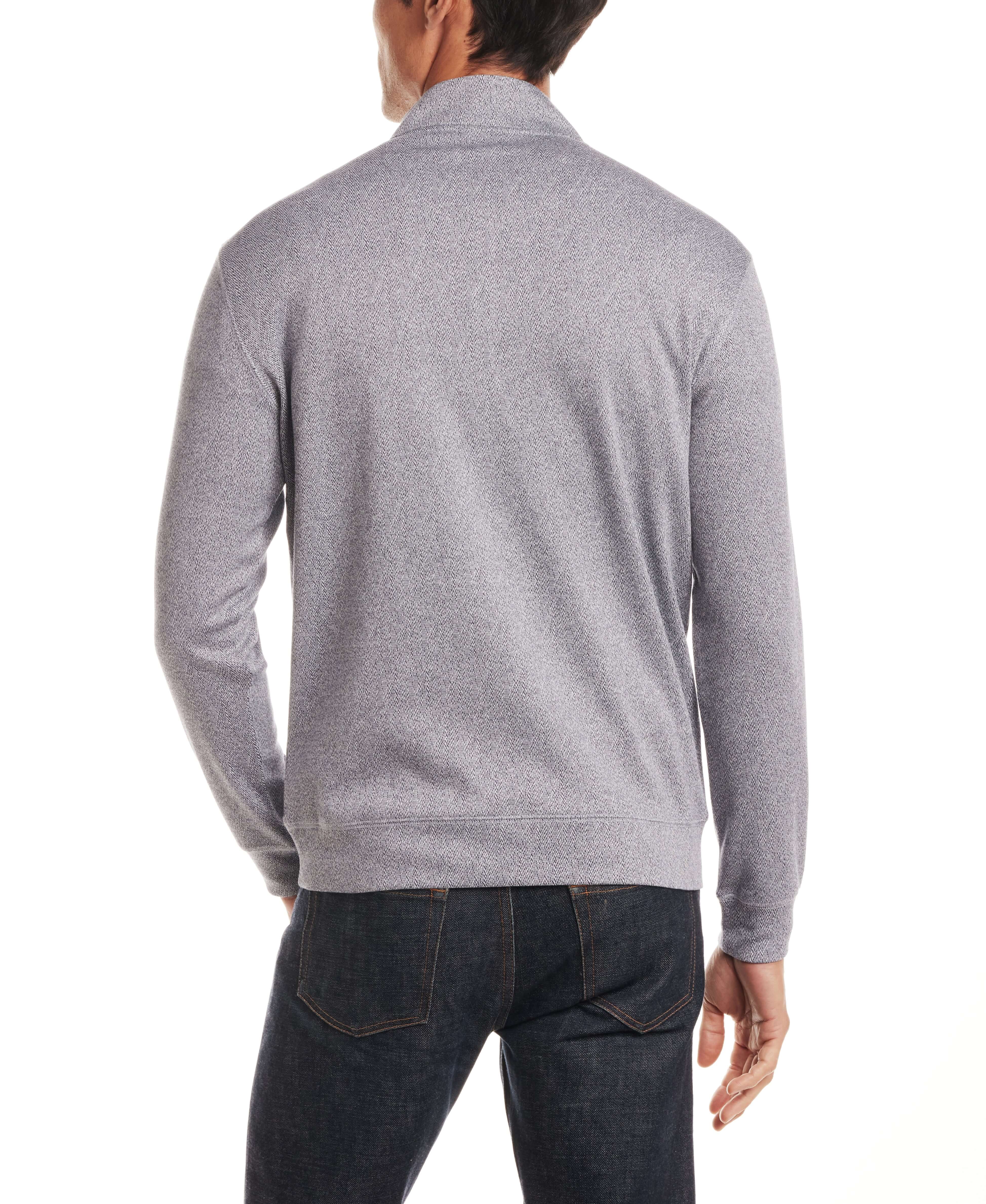 Model wearing Long Sleeve Quarter Zip in Maritime Blue, showcasing the back view and smooth texture.