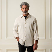 Long Sleeve Solid Cord Button Down Cream worn by a model, showcasing its soft corduroy texture and versatile design.