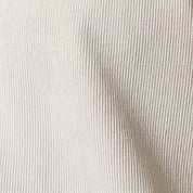 Close-up of the fabric texture of Long Sleeve Solid Cord Button Down Cream, showcasing soft corduroy design.