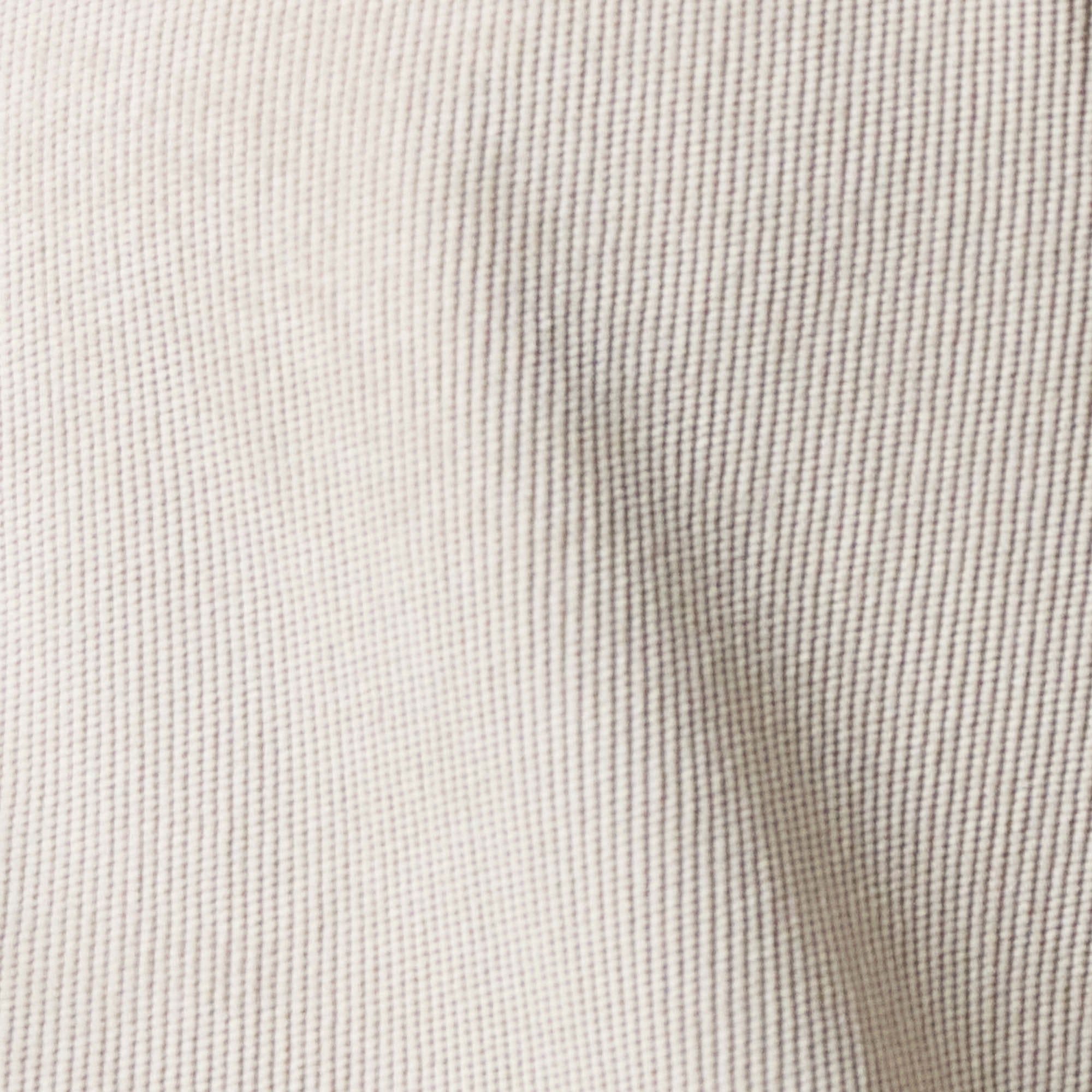Close-up of the fabric texture of Long Sleeve Solid Cord Button Down Cream, showcasing soft corduroy design.