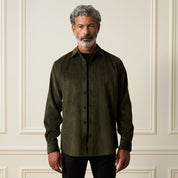 Long Sleeve Solid Cord Button Down in Olive worn by a model, featuring a button front and spread collar.