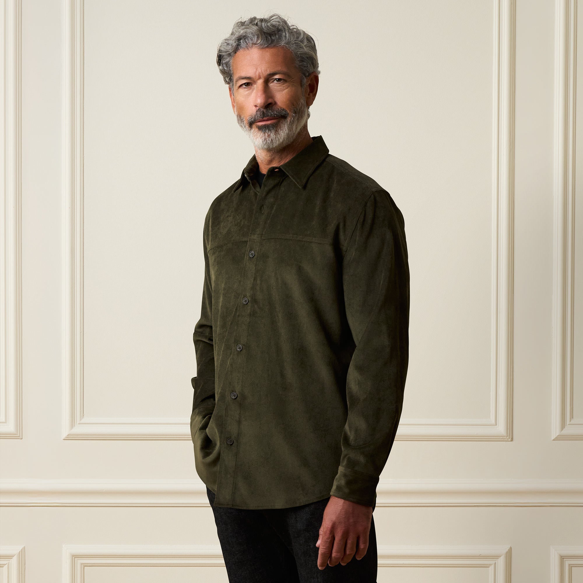 Long Sleeve Solid Cord Button Down in Olive worn by a man, showcasing its soft corduroy texture and buttoned front.