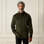 Long Sleeve Solid Cord Button Down in Olive worn by a model, featuring a button front and spread collar.
