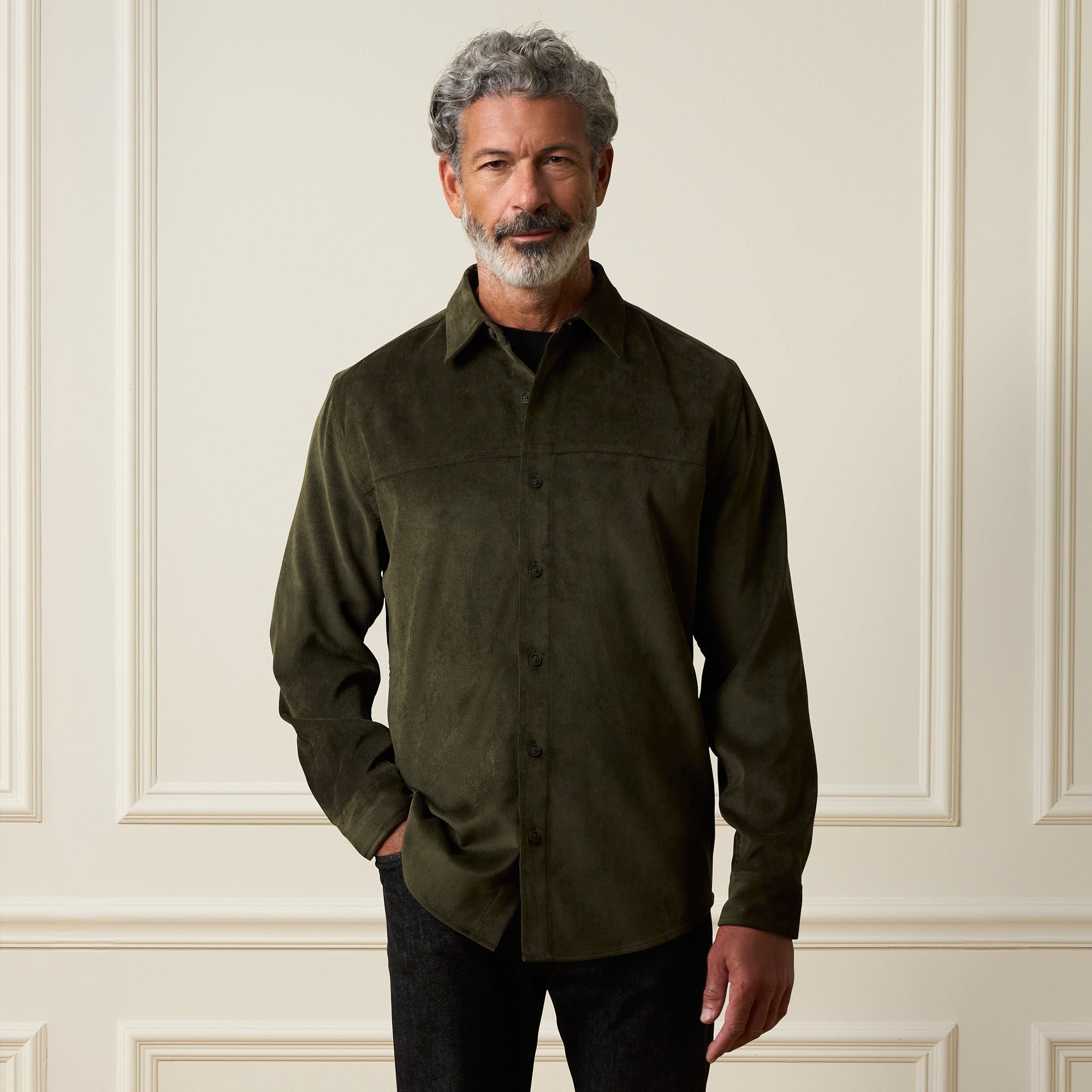 Long Sleeve Solid Cord Button Down in Olive worn by a model, featuring a button front and spread collar.