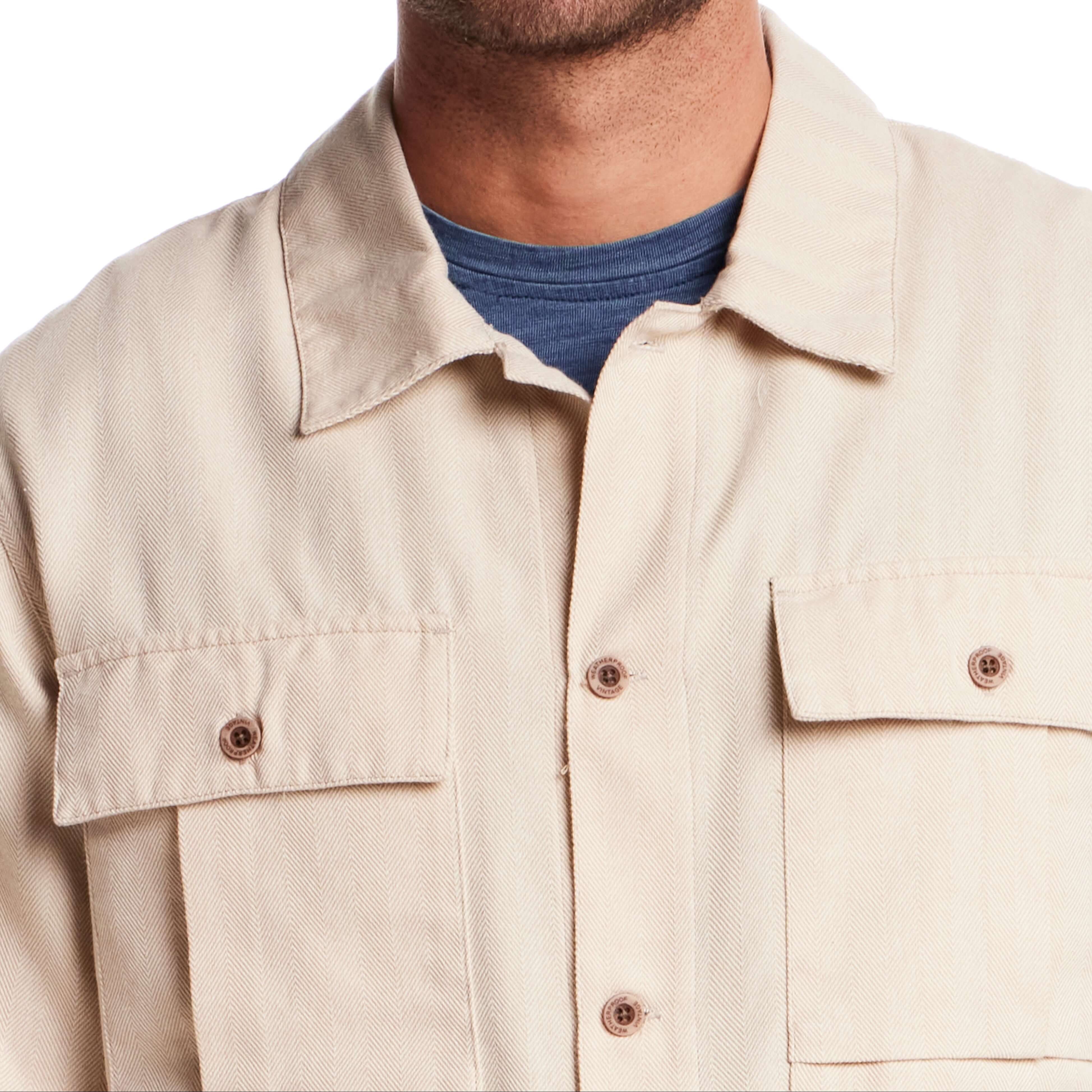 Close-up of a long sleeve unlined utility shirt jacket in white pepper with button-through pockets and a classic fit.