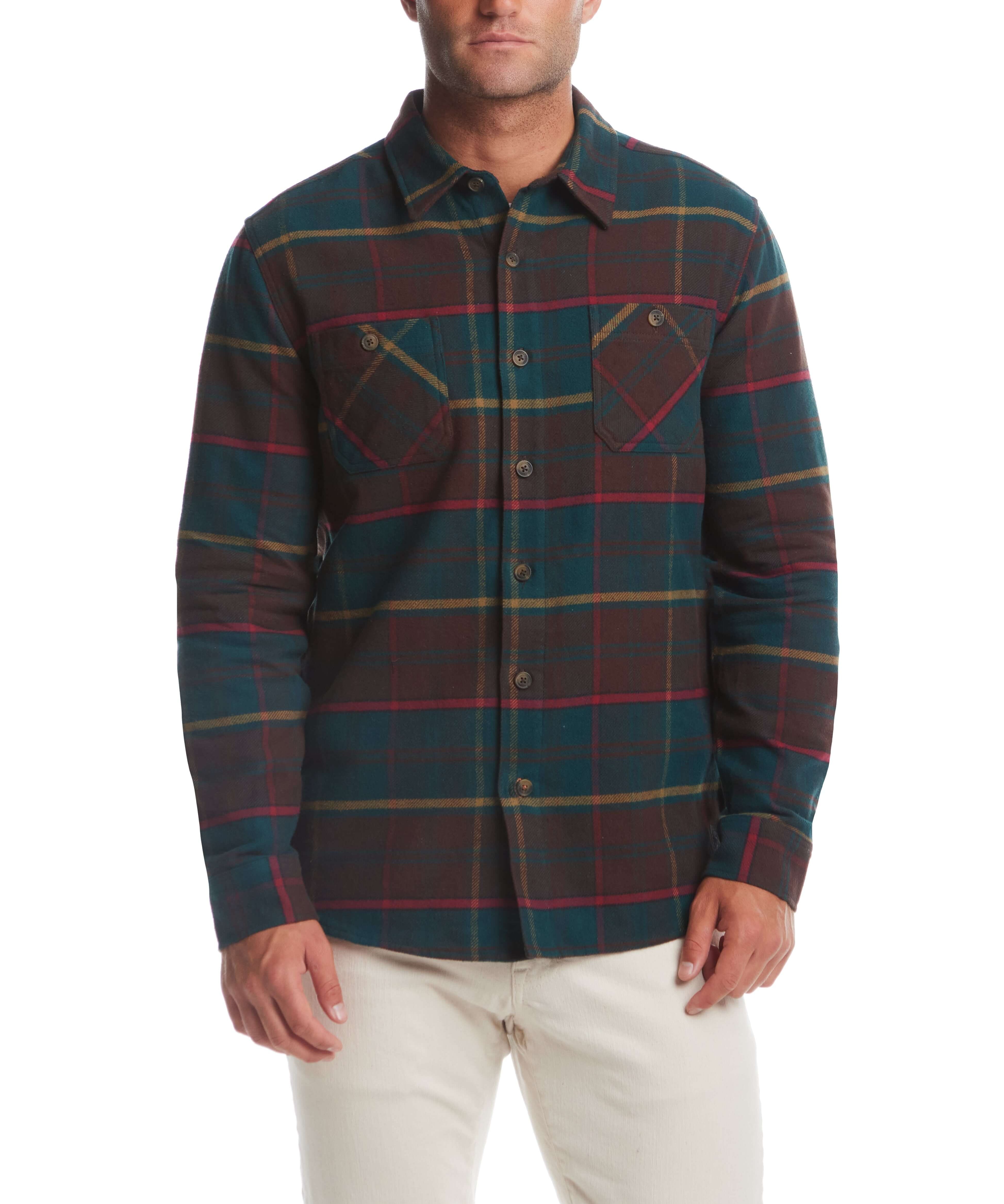 Men's lumberjack flannel unlined shirt jacket in forest biome with muted plaid design and chest pockets.