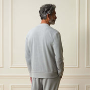 Mini Herringbone Bomber Jacket in Natural displayed from the back, showcasing its relaxed fit and subtle texture.