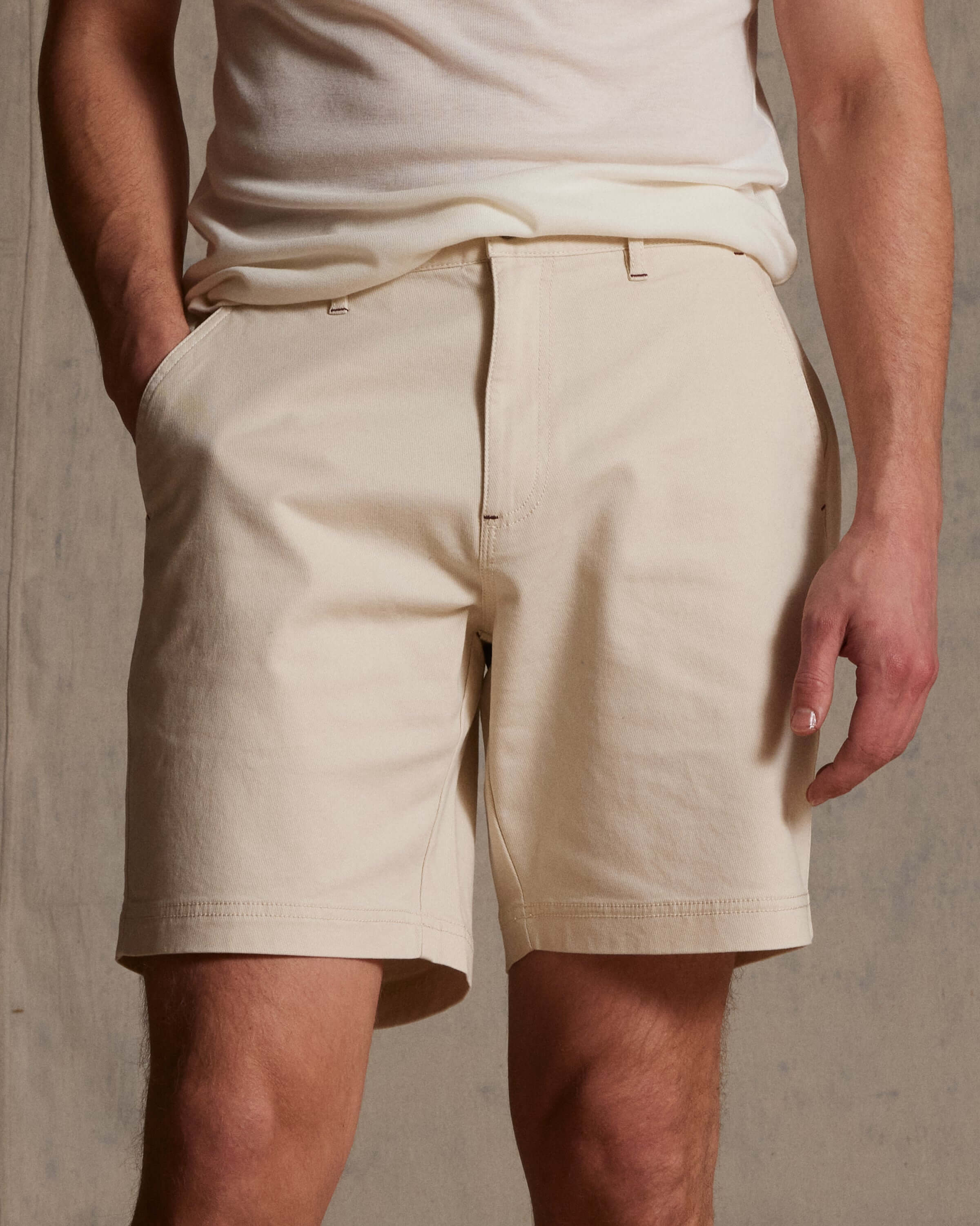 The 8" Twill Short in Stone, featuring a flat front and side pockets, perfect for warm weather outings.