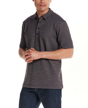 Jacquard Stripe Polo in Black worn by model showcasing subtle jacquard striping and structured look.