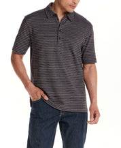Model showcasing the Jacquard Stripe Polo in Black, featuring subtle striping and a structured fit.